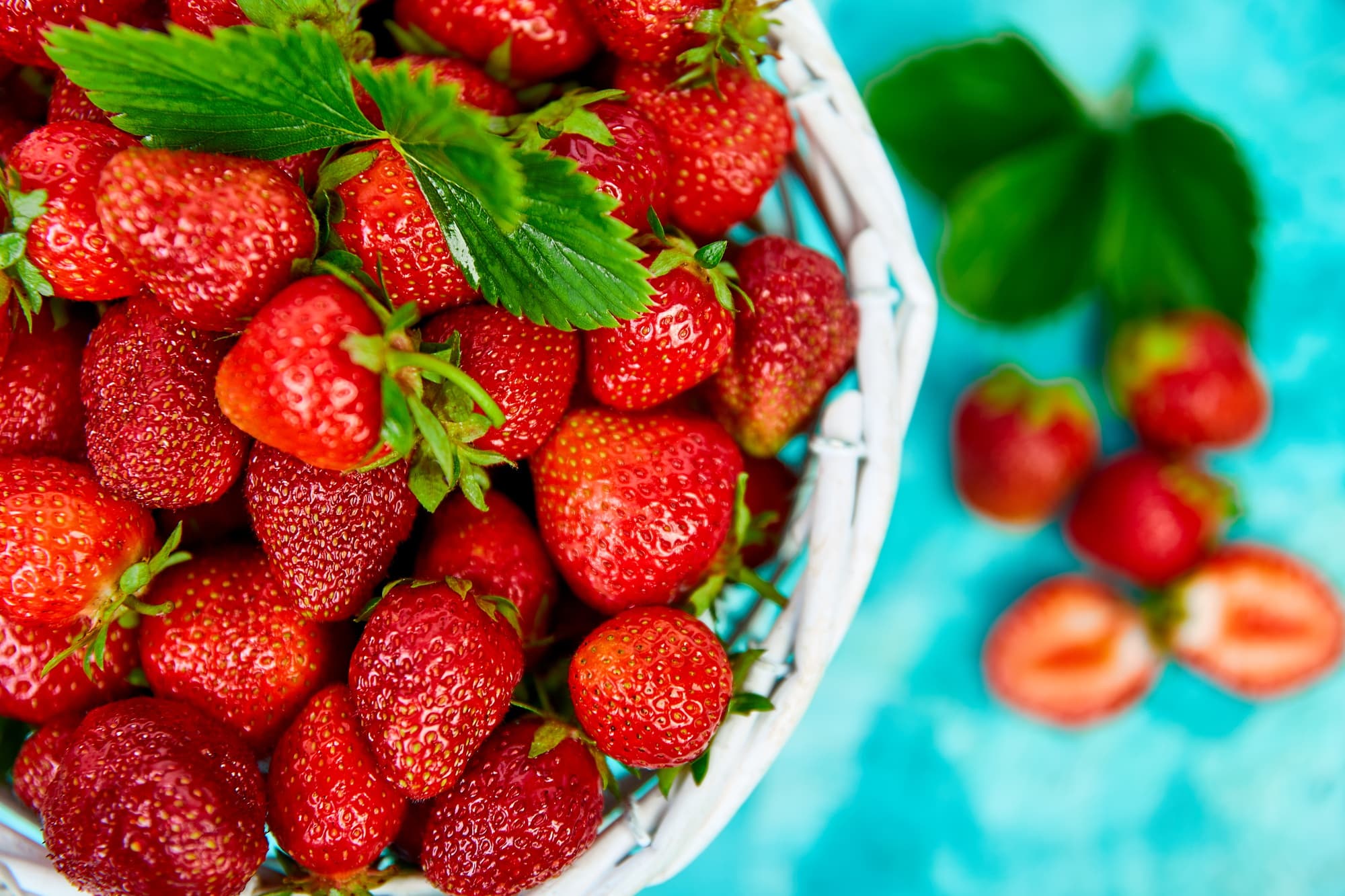 Strawberries in white basket. Fresh strawberries. Beautiful strawberries.