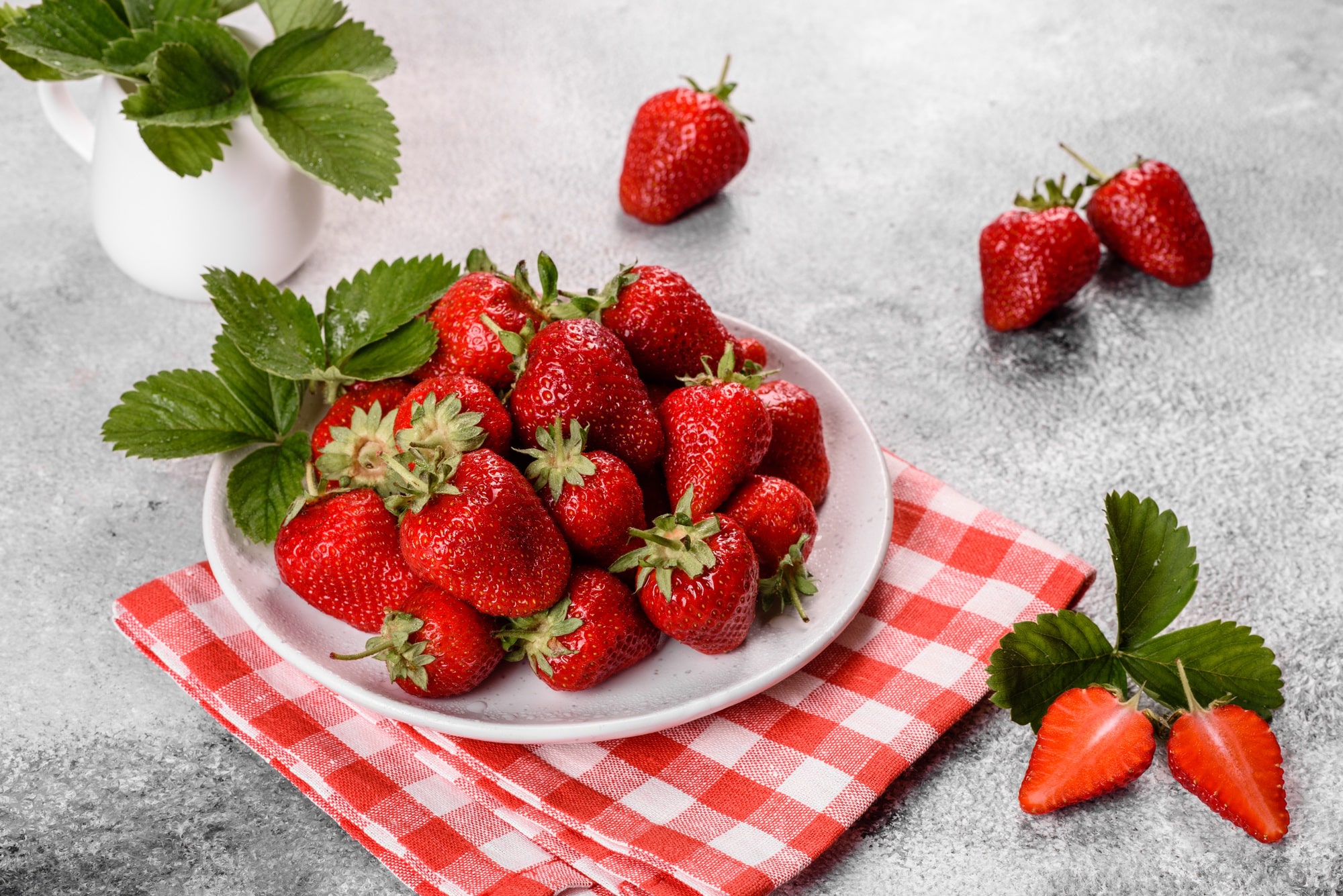 Beautiful juicy fresh strawberries on the concrete surface of the table